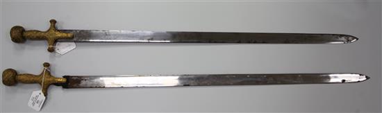 A near pair of Indian sword tulwars, late 19th century, L 81cm (blade)